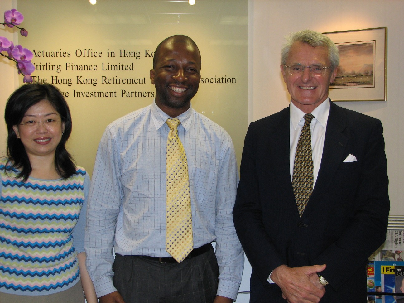Olawale Opayinka at the Joint Actuaries Office in Hong Kong with Pat Kum and Stuart Leckie FIA, June 2006