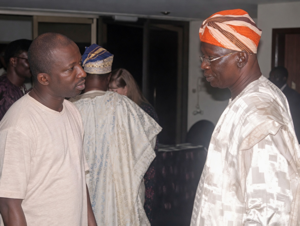 Olawale Opayinka in conversation with the late Chief Adigun, pioneering Nigerian actuary, at a conference in Nigeria